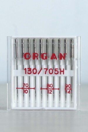 Cajita blanca con surtido de 10 agujas de coser a máquina universales. En la caja se puede leer en rojo la marca, ORGAN, y los grosores de la aguja: 70, 80 y 90.