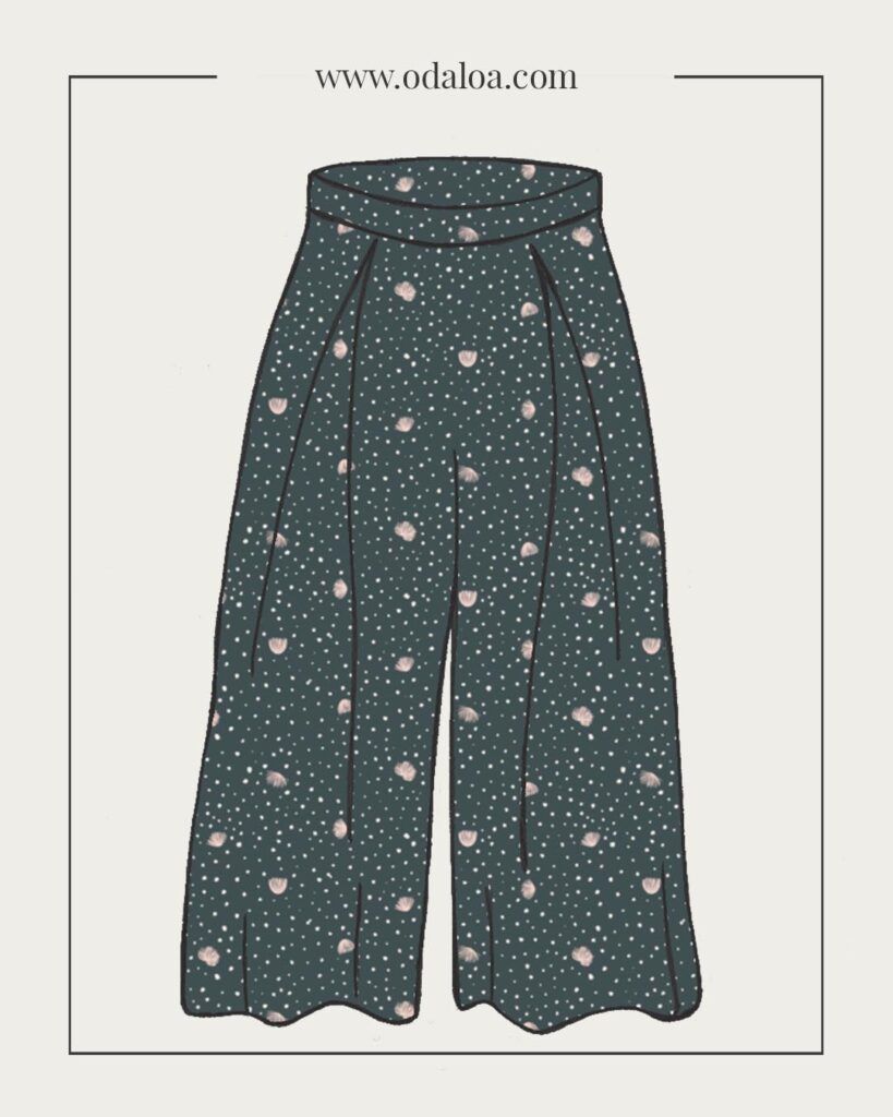 Dibujo de pantalón culotte, con una largura por debajo de la rodilla. Cuenta con dos pliegues que salen de la cinturilla. Son de color ceniza, con motivos de flores abstractas en un rosa pálido casi blanco, con puntitos irregulares más pequenos.