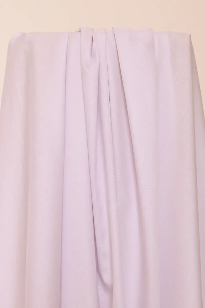Tela deadstock de algodón en un color malva suave y con una bonita caída